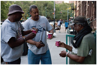 Photo of Harlem residents holding coffees
